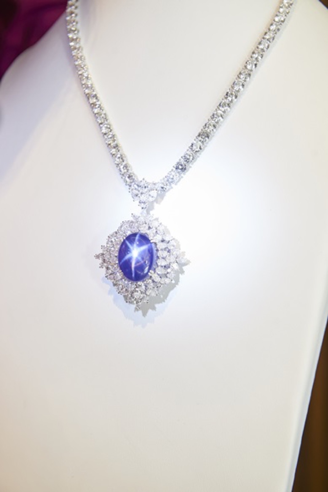 The Star of Genesis pendant, its six-rayed star alive under the showroom lights