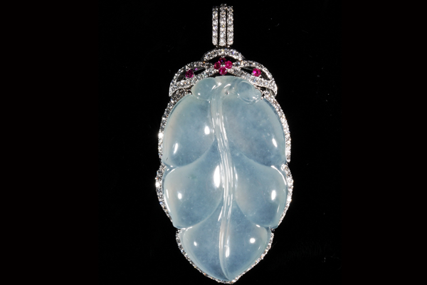 An icy jadeite leaf beneath a canopy of diamonds and ruby buds.