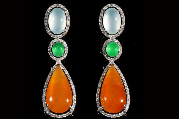 Icy, vivid green and honeyed jadeite in descending drops, each traced in diamonds.