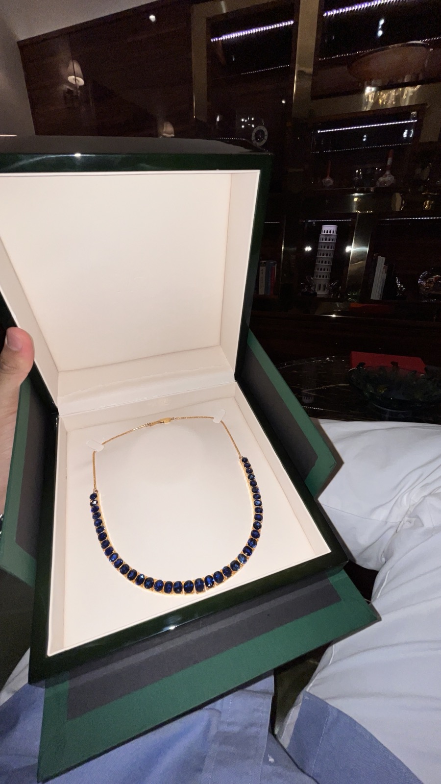 A necklace of royal blue sapphires set in gold, in its presentation case